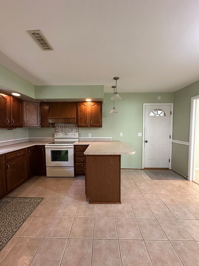 Building Photo - Not Your Typical Rental — Warm, Welcoming 3BR Brick Ranch in a Prime Neighborhood