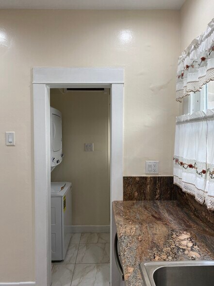 Laundry off of kitchen - 301 Grand Ave