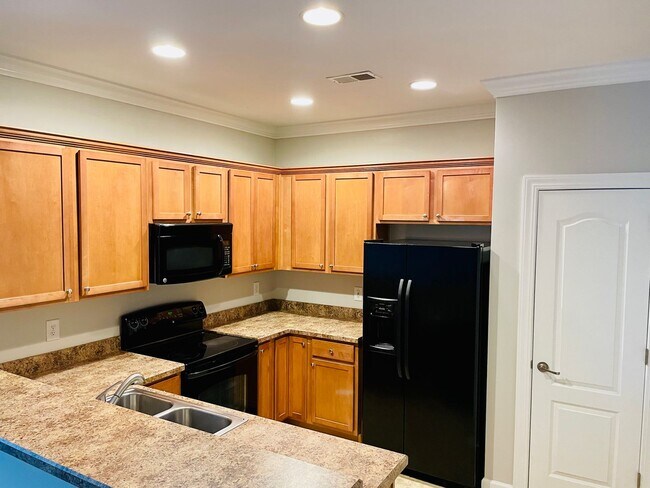 Building Photo - BRAND NEW FLOORING & FRESH PAINT - 3 Bedroom/2.5 Bath Townhome with garage in Wild Wing!