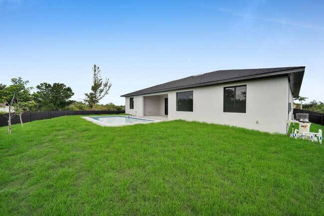 Building Photo - Brand-New Pool Home for Rent – Port Charlo...