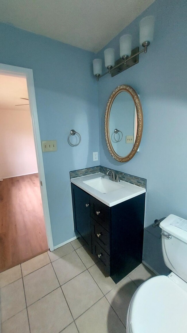 The Blue Bath has a New Vanity and Backsplash. It Also has a Walk-In Shower - 5538 W Ridgecreek Dr