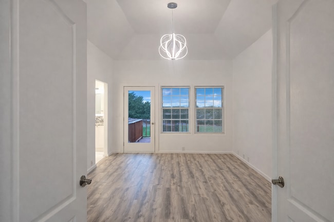 Building Photo - Executive 3 Bed Home with 3 Car Garage & Private Fenced Yard