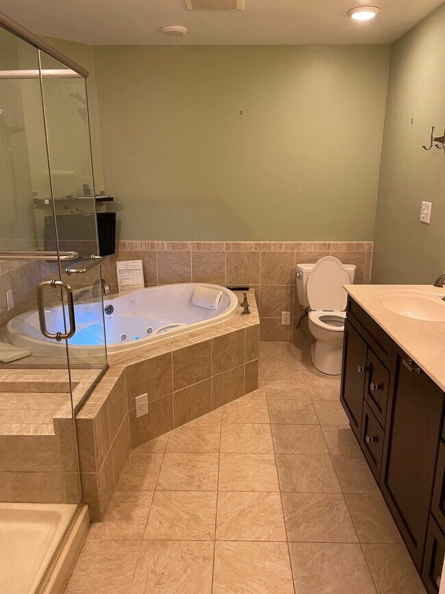 Building Photo - Spacious 3BR Townhome with Walkout Basement, Deck, Fenced Yard, Central A/C + Assigned Parking