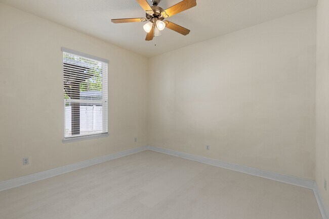 Building Photo - Spacious 6-Bedroom Home Near Lake Nona | 3-Car Garage + Tesla Charger