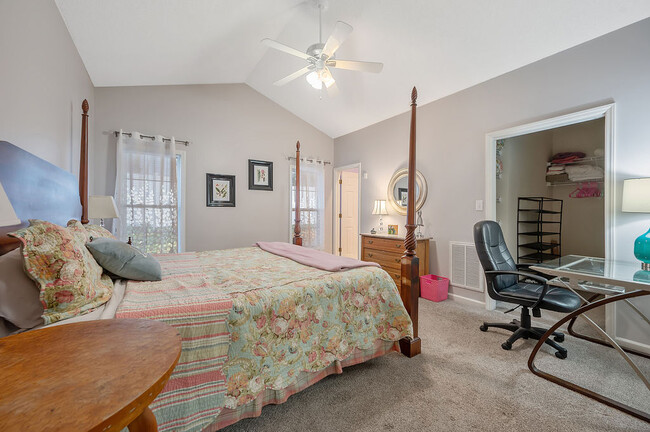 Master bedroom with king size bed - 2412 Laurel Falls Ln