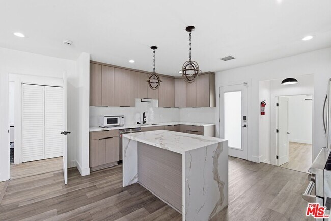 Building Photo - 6415 Madden Ave