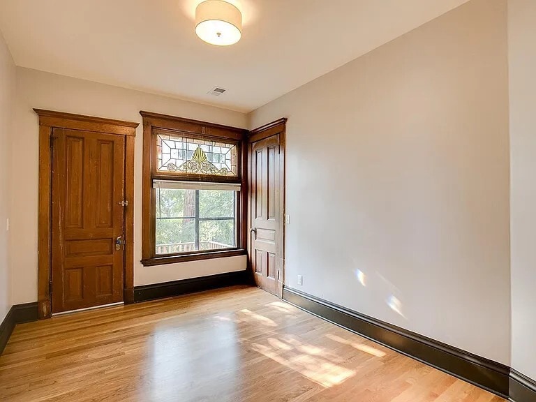 Bedroom 1 with private balcony - 1609 Elliot Ave