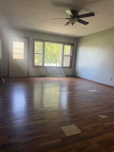 Living room 2- - floor being replaced - 216 S. College Avenue
