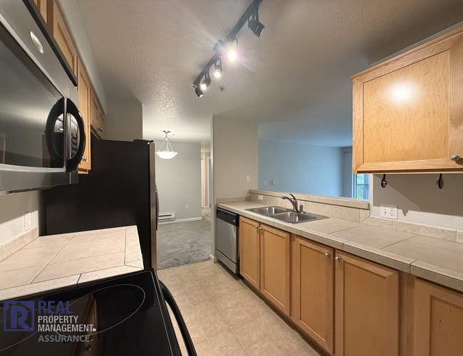 Building Photo - Tanasbourne 2BR/2BA Condo | Balcony, A/C & Covered Parking