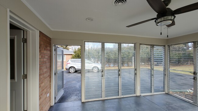 View from sunroom toward kitchen door and exit toward garage area - 6934 Winding Way