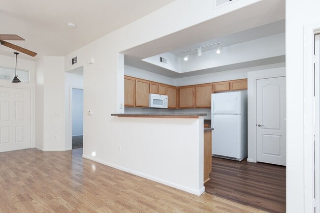 Building Photo - 1st floor unit with garage in gated Hender...