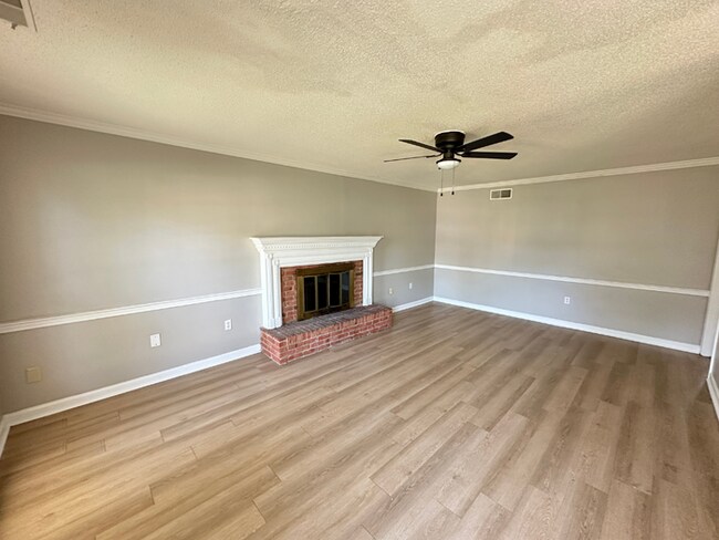 Building Photo - Charming 3BR/2BA Near Southwind | Hardwood Floors, Brick Fireplace, Bay Window & 2-Car Garage