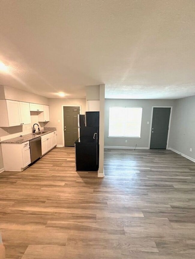 Building Photo - The Den: Where Comfort Meets Community