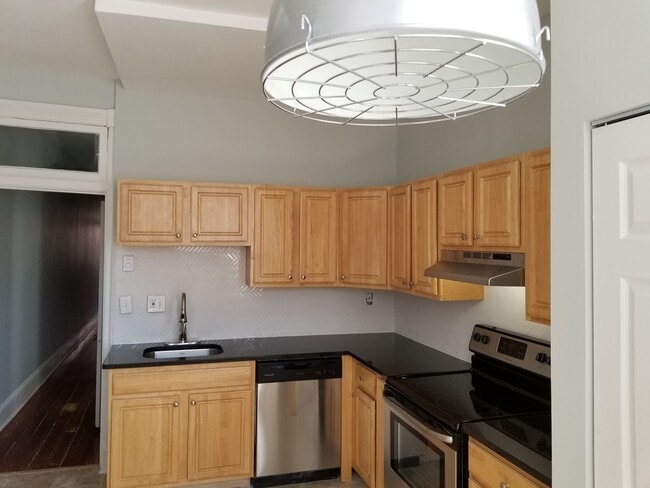 Granite counter tops and stainless steel appliances (Unit 2) - 211 E Biddle St