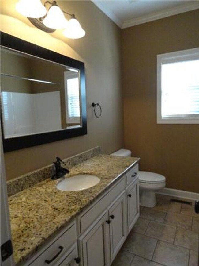 Building Photo - Luxury Living! Beautiful Brick Home in Sango with 3 car garage.