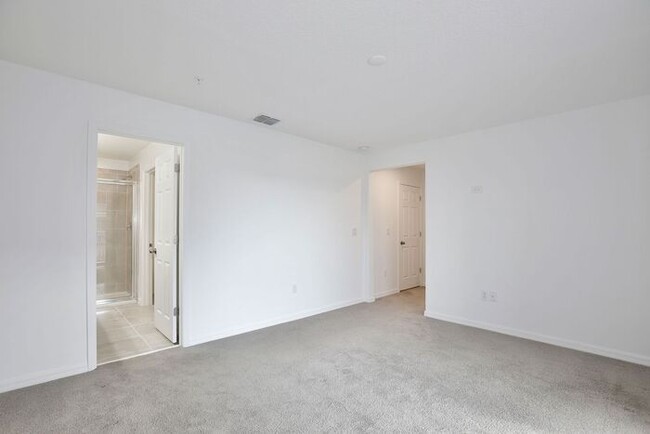 Building Photo - Luxurious 3/2.5 Modern Townhome with a Private Balcony and a 2 Car Garage in the Exclusive Gated ...