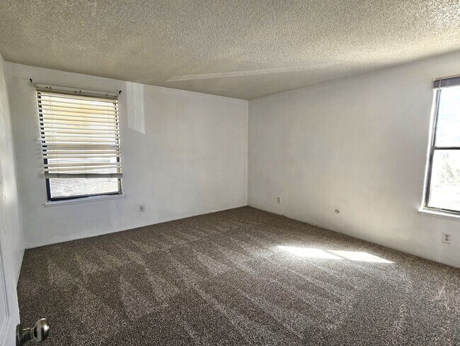 Building Photo - Roomy 1 Bedroom Condo on 2nd Floor with Covered Balcony