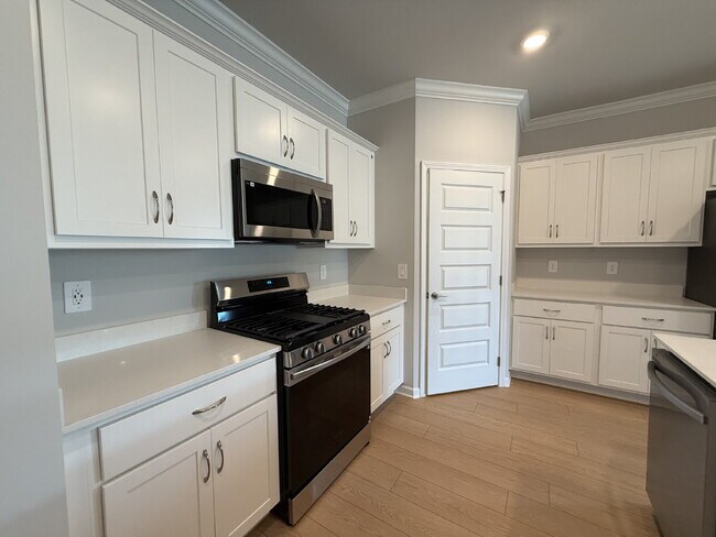 Building Photo - "NEWLY BUILT- Spacious 4-Bedroom Haven with Granite Elegance and Cozy Fireplace in Harvest"