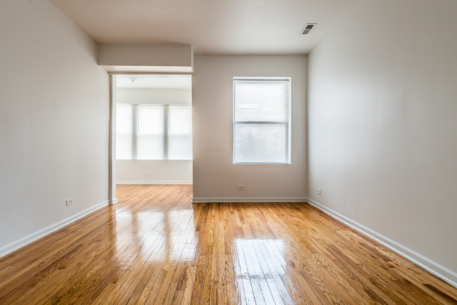 Your living room leads into a sunroom in this beautiful apartment at 1357 N Homan - 1357 N Homan Ave