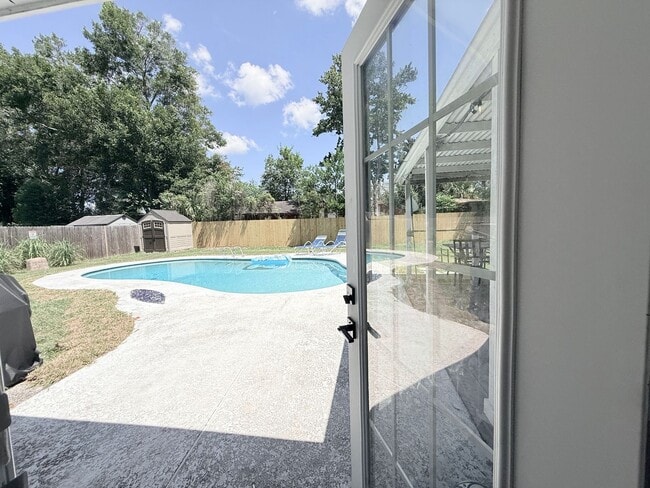 Building Photo - Renovated Pool Home with Private Backyard Oasis
