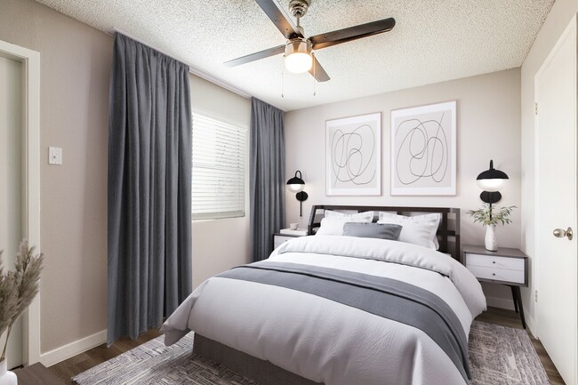 Relax in the spacious master bedroom, designed for comfort and style. With contemporary finishes, wood-style flooring, and a ceiling fan for year-round comfort, this inviting space is ready to be your personal retreat. - Villa De Oro