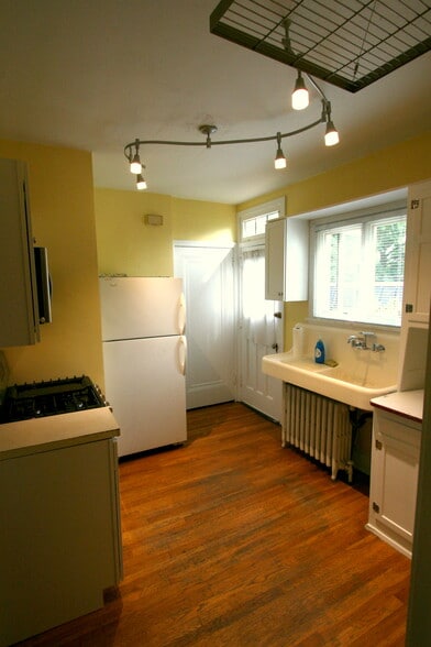 Kitchen looking toward side door and Basement door - 328 S Aiken Ave
