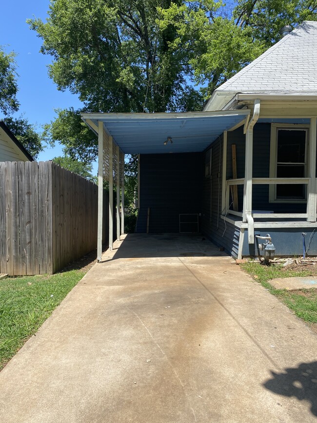 Carport leading to kitchen - 430 E Woodard St