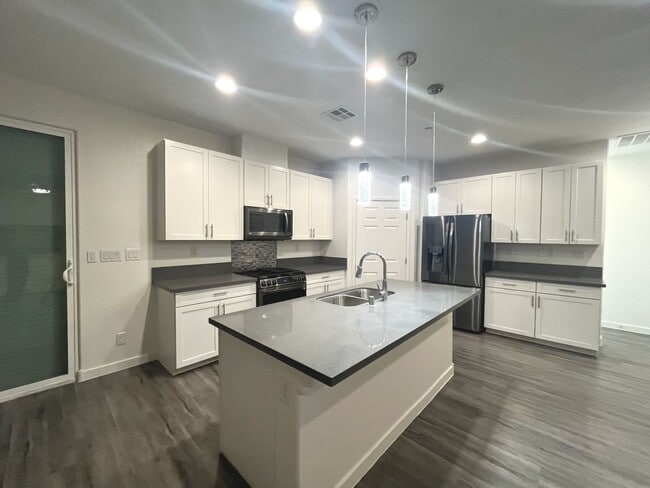 Building Photo - Single-story 1326 sq ft, townhome built in 2019 w/3 bed, 2 bath & spacious attached 2-car garage ...