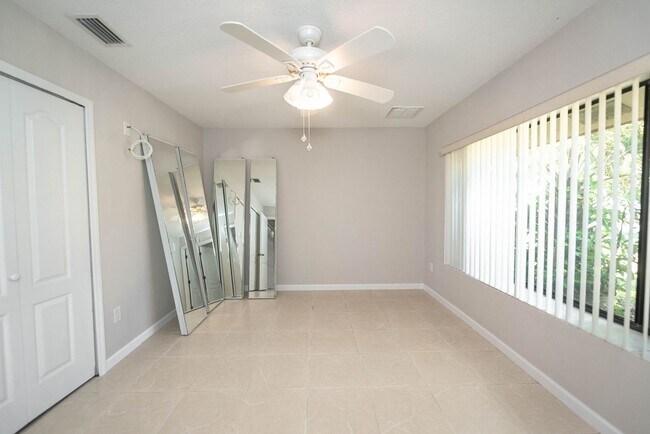 Building Photo - Welcome to this spacious three-bedroom, three-bath home in the heart of Palm Bay