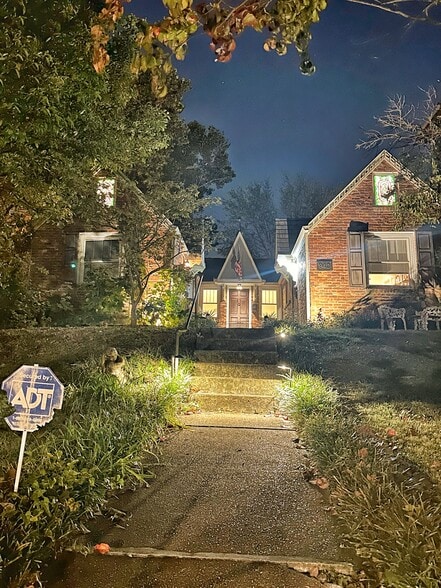 The Valentino is majestic at night welcoming you home with lit stained glass windows and charm - 942 Russell St