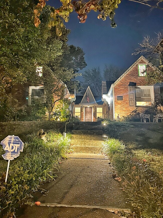 The Valentino is majestic at night welcoming you home with lit stained glass windows and charm - 942 Russell St