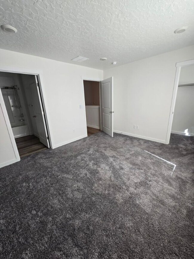 Building Photo - Nearly New, Well Appointed Modern Townhouse w 2 car attached garage