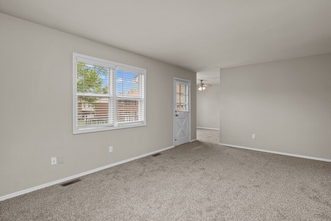 Two Bedroom Garden Remodel with Fireplace | Living & Dining Space - Woods Mill Park Apartments & Townhomes