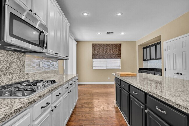 Building Photo - A Fabulous 4 Bedroom Home with a Sparkling...