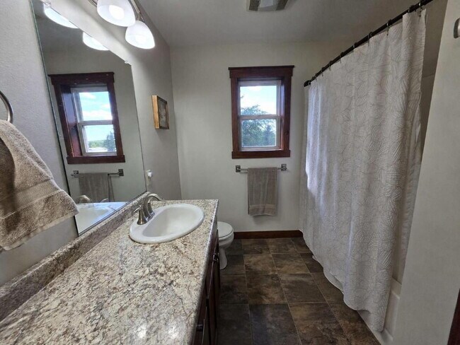 Building Photo - FREE SEPTEMBER RENT for this Spacious 4-Bedroom Home with Vaulted Ceilings with Finished Basement...
