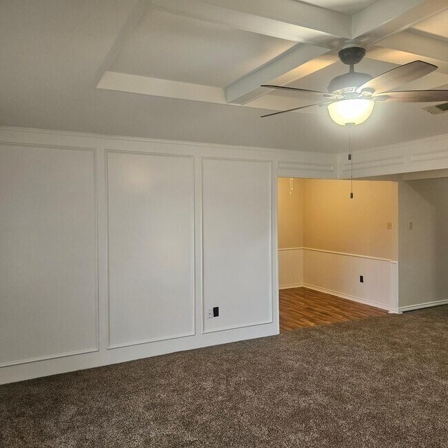 Building Photo - Three bedroom and two bathroom nicely remodeled with new flooring. Large wood fenced backyard