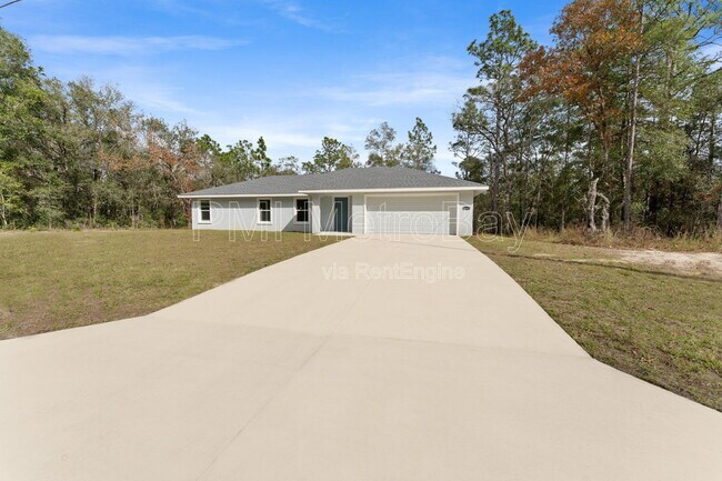 Building Photo - 9461 N Sandree Dr