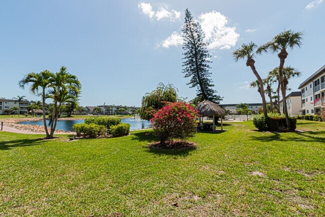 Building Photo - AVAILABLE NOW! Furnished Ground-Floor End Unit | Lake & Pool Views | Minutes to Marco Island & Do...
