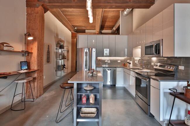 European Cabinetry, Islands and Stainless Steel Appliances in Our Loft Kitchens - Modera Lofts