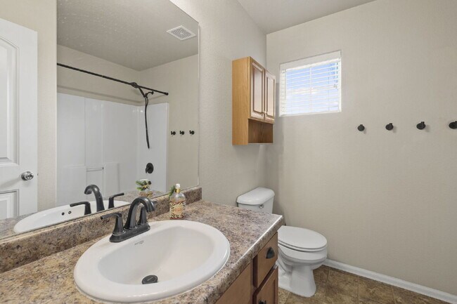 Building Photo - Spacious 4-Bedroom Home with Loft, Solar & Fenced Backyard