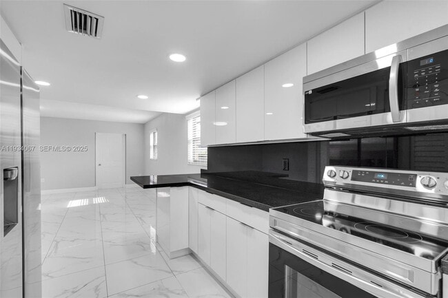 Building Photo - 5061 W 12th Ln