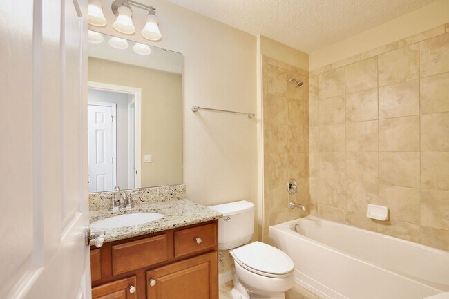 Building Photo - AGENT SHOWINGS ONLY! Gorgeous 2/2 + Den Mediterranean Villa with Waterfront Screened Patio and 2-...