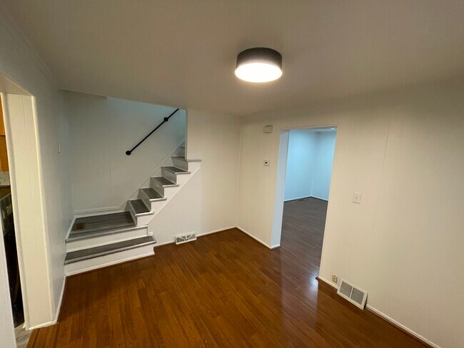 Fresh luxury vinyl plank stairs lead to the second floor - 212 Lorenz Ave