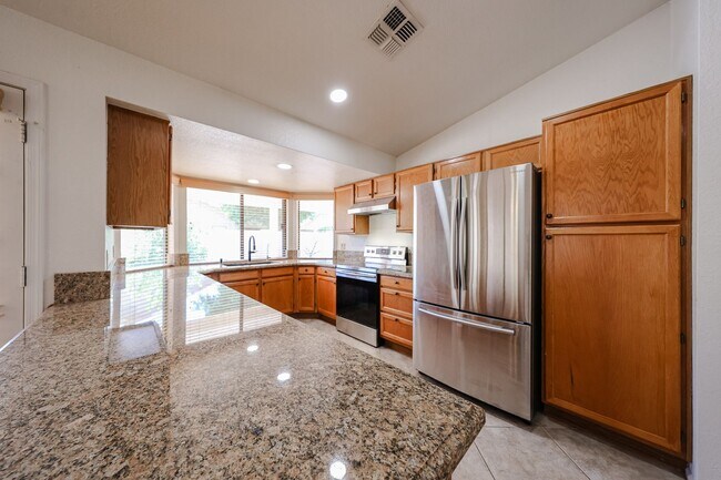 Building Photo - Welcome to this stunning 4-bedroom, 2-bath...