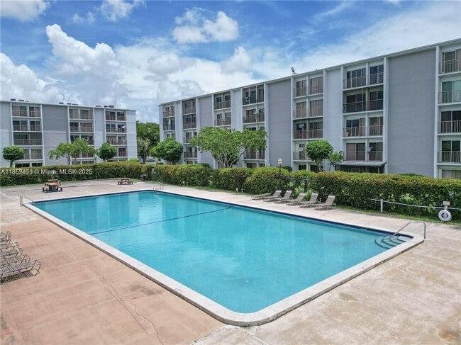 Building Photo - $2,100MONTHLY;8740 N SHERMAN CIR. #408 MIR...