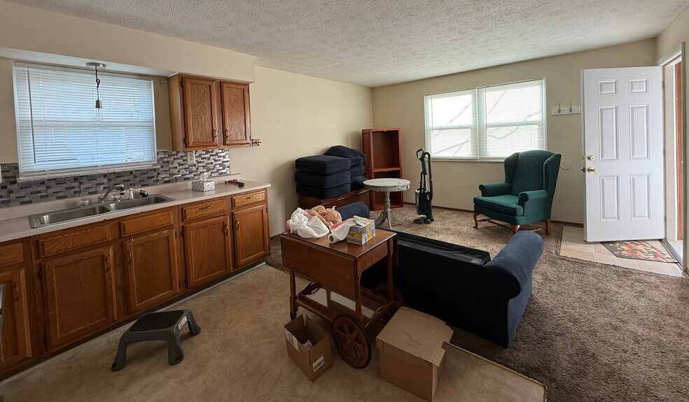 Living room and kitchen area. Shown furnished. Apartment rented unfurnished. - 211 Walnut St