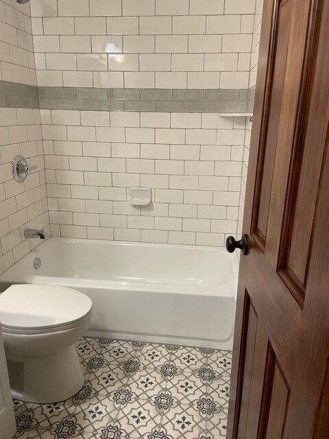 Tiled shower with tub. - 214 E Vermilya Ave