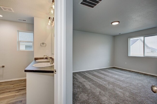 Building Photo - The 3 bedroom, 2 bedroom home also has a f...