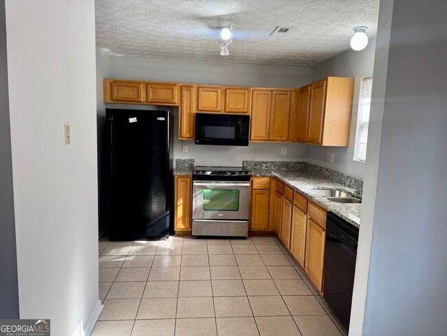 Building Photo - 5663 Windfall Ln