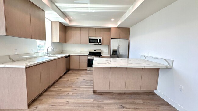 Building Photo - Oversized 2-Bedroom with Open Layout and D...